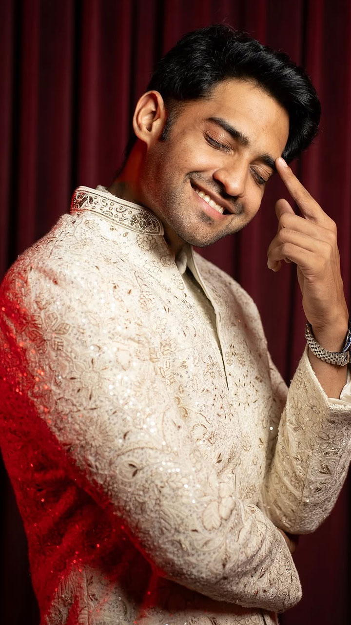 Mahesh flaunts a sleek wristwatch, adding a modern touch to the traditional ensemble.